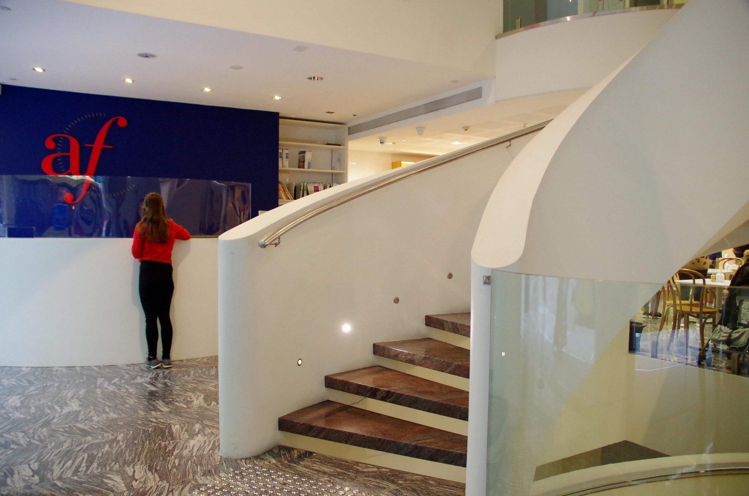 Cascading staircase and reception desk at Alliance Francaise de Sydney Centre in Sydney's CBD, designed by architect Harry Seidler