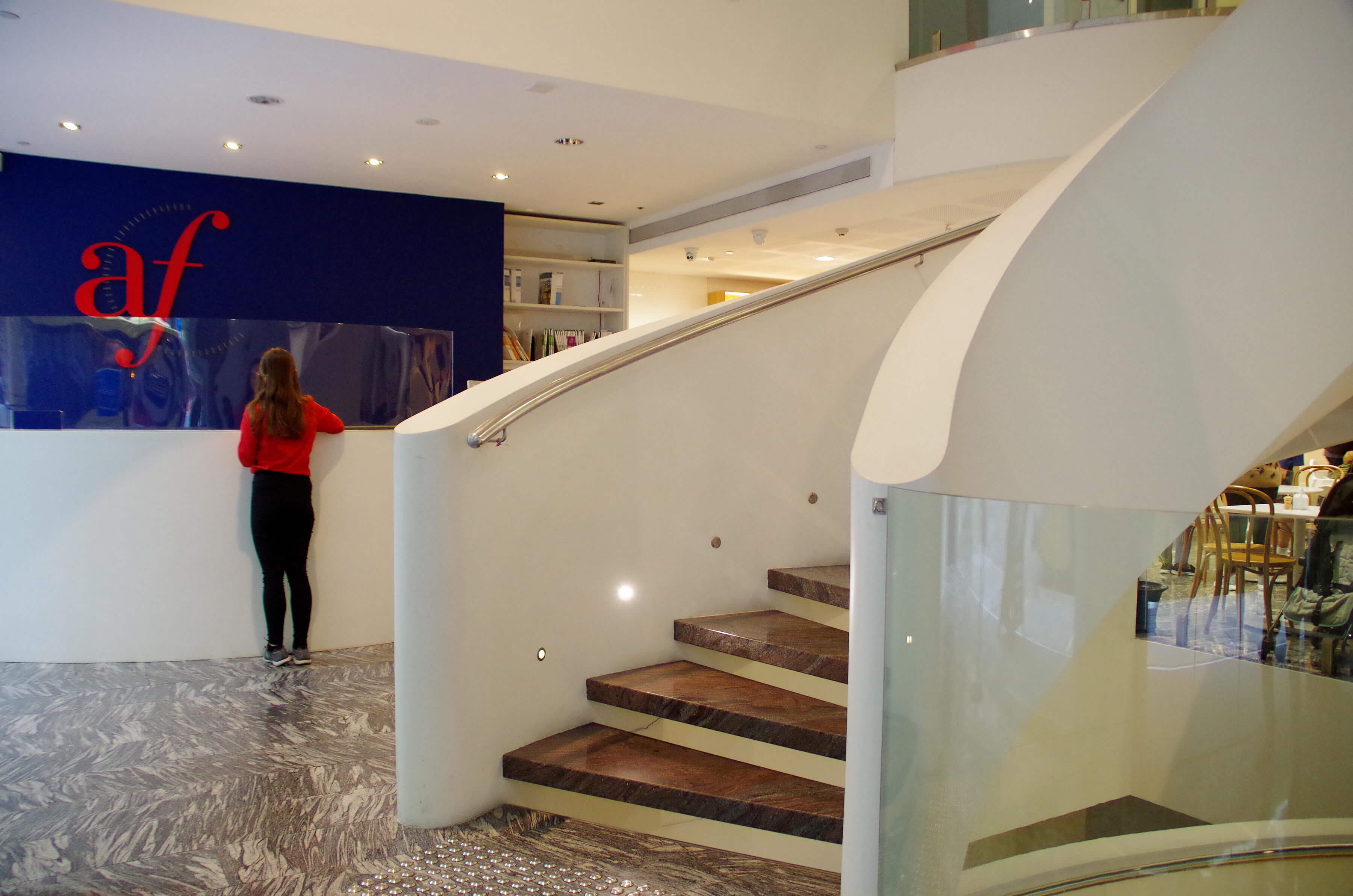 Photo:Caroline Seltz Cascading staircase and reception desk at Alliance Francaise de Sydney Centre in Sydney's CBD, designed by architect Harry Seidler