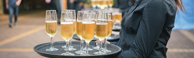 Champagne glasses on serving platter